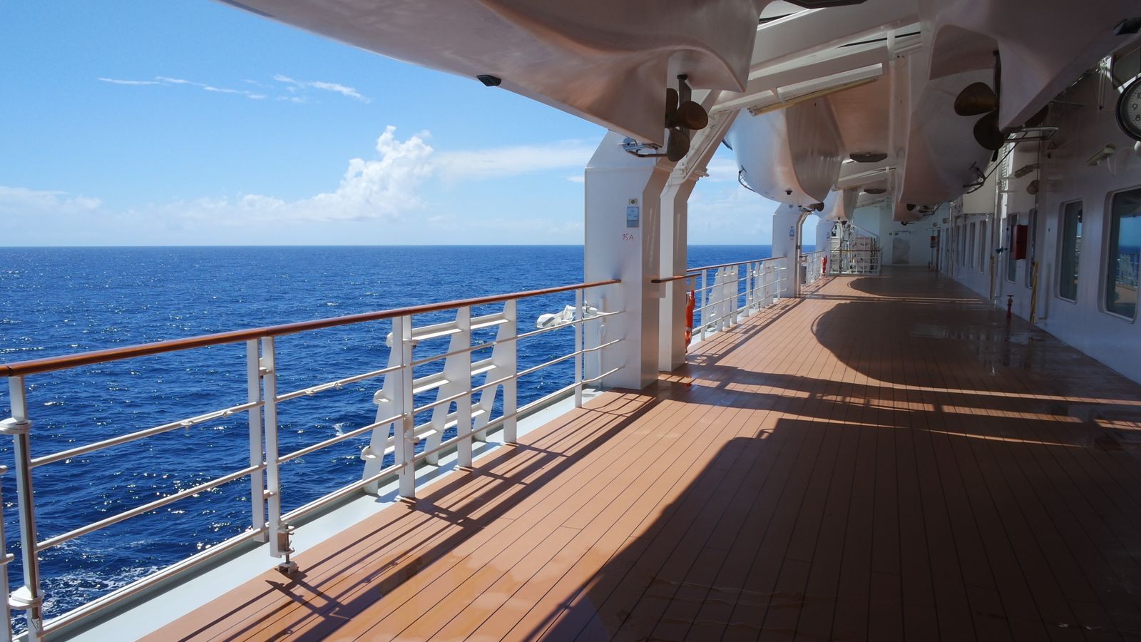 Sunny open deck of a cruise ship beside the ocean